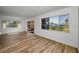 Spacious living room with modern flooring, large windows and lots of natural light at 3847 Lighthouse Way # 3847, New Port Richey, FL 34652