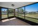 Screened lanai offering serene views of the water and surrounding landscape at 3847 Lighthouse Way # 3847, New Port Richey, FL 34652