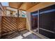 Secluded outdoor patio with wooden fence and sliding glass door access at 3847 Lighthouse Way # 3847, New Port Richey, FL 34652