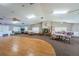 Spacious recreation room featuring a fireplace, tables, and ample seating at 3847 Lighthouse Way # 3847, New Port Richey, FL 34652