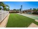Active shuffleboard courts area next to a covered seating area, creating a lively and social community space at 3847 Lighthouse Way # 3847, New Port Richey, FL 34652