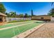 Well-maintained shuffleboard courts surrounded by lush landscaping, offering a fun and active recreational space at 3847 Lighthouse Way # 3847, New Port Richey, FL 34652