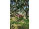 Welcoming Beacon Lakes community entrance sign nestled among mature trees and vibrant landscaping at 3847 Lighthouse Way # 3847, New Port Richey, FL 34652