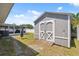 Backyard shows a view of the shed and the enclosed porch area, along with a heavy hanging bag at 4715 W Montgomery Ave, Tampa, FL 33616