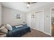 Bedroom with blue blanket, one window, ceiling fan, and closet at 4715 W Montgomery Ave, Tampa, FL 33616