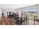 Dining room with wood floors, natural light, and neutral paint at 4715 W Montgomery Ave, Tampa, FL 33616