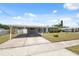 This single-story home has a covered carport, a manicured lawn and well kept landscaping at 4715 W Montgomery Ave, Tampa, FL 33616
