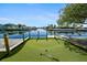 Enjoy waterfront living with a private putting green and easy access to the canal and water activities at 4968 Southshore Dr, New Port Richey, FL 34652