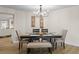 Dining room with modern chandelier, neutral decor and seating for six at 4968 Southshore Dr, New Port Richey, FL 34652