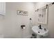 Charming half bathroom with wall art, accent mirror, and updated fixtures at 4968 Southshore Dr, New Port Richey, FL 34652
