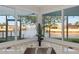 Close-up of a modern kitchen sink with water views through expansive windows at 4968 Southshore Dr, New Port Richey, FL 34652