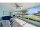 Cozy screened lanai with waterfront views, comfortable seating, and coastal decor at 4968 Southshore Dr, New Port Richey, FL 34652