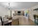 Open living space with a dining room area, decorative accent wall, and sliding door access to the outdoor patio at 4968 Southshore Dr, New Port Richey, FL 34652