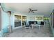Comfortable waterfront patio featuring stylish furniture, a heat lamp, and scenic views at 4968 Southshore Dr, New Port Richey, FL 34652