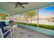 Charming waterfront patio featuring comfortable seating and beautiful views of the canal at 4968 Southshore Dr, New Port Richey, FL 34652