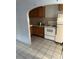 Kitchen with white appliances and white tile flooring at 5829 32Nd N St, St Petersburg, FL 33714