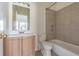 Bathroom with modern vanity, tiled bathtub, and recessed niche for storage at 6343 Osprey Lake Circle, Riverview, FL 33578