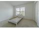 Cozy bedroom with neutral carpeting, window with blinds, and closet space at 6343 Osprey Lake Circle, Riverview, FL 33578