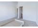 Spacious bedroom with plush carpeting and open doorway to the ensuite bathroom at 6343 Osprey Lake Circle, Riverview, FL 33578