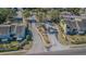 The entrance is flanked by well-maintained landscaping, trees, and townhouses, for a welcoming community feel at 6343 Osprey Lake Circle, Riverview, FL 33578