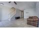 Open concept living area with tile floors, staircase, and a comfortable sofa for relaxing and entertaining guests at 6343 Osprey Lake Circle, Riverview, FL 33578