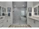 Bathroom showcasing a glass-enclosed shower, soaking tub and double vanities at 718 Manns Harbor Dr, Apollo Beach, FL 33572