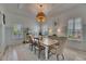 Light-filled dining room showcasing a stylish table and comfortable seating for Gathering gatherings at 718 Manns Harbor Dr, Apollo Beach, FL 33572