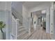 Entryway with stairs leading to the home's main living spaces at 718 Manns Harbor Dr, Apollo Beach, FL 33572