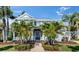 Charming coastal home with lush landscaping and a welcoming front porch perfect for relaxation at 718 Manns Harbor Dr, Apollo Beach, FL 33572