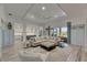 Spacious living area with an L-shaped sofa and backyard views at 718 Manns Harbor Dr, Apollo Beach, FL 33572
