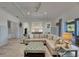 Bright, open living room featuring stylish decor, recessed lighting, and seamless flow into the kitchen at 718 Manns Harbor Dr, Apollo Beach, FL 33572
