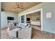 Cozy outdoor patio space with plush seating, overlooking the bright and inviting living room at 718 Manns Harbor Dr, Apollo Beach, FL 33572