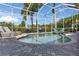 Inviting pool featuring a brick surround, manicured landscaping, and comfortable lounge chairs at 718 Manns Harbor Dr, Apollo Beach, FL 33572