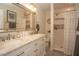 Modern bathroom with double vanity, elegant mirror, shower, and great lighting at 7301 2Nd S Ave, St Petersburg, FL 33707