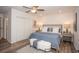 Cozy bedroom featuring a plush bed, ceiling fan and modern decor at 7301 2Nd S Ave, St Petersburg, FL 33707