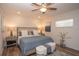 Bright bedroom featuring a plush bed, ceiling fan and bedside lamps at 7301 2Nd S Ave, St Petersburg, FL 33707