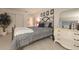 Charming bedroom with a queen bed, elegant decor, and ample natural light at 7301 2Nd S Ave, St Petersburg, FL 33707