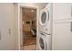 Convenient laundry room featuring stackable washer and dryer units with lots of storage at 7301 2Nd S Ave, St Petersburg, FL 33707