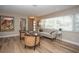 Bright living room features stylish seating, hardwood floors, and natural light from a large window with modern decor at 7301 2Nd S Ave, St Petersburg, FL 33707