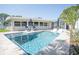 Backyard pool area with inviting patio furniture and clear, refreshing water at 7301 2Nd S Ave, St Petersburg, FL 33707