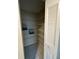 Walk-in closet with ample storage shelving and tile flooring at 7601 Como Dr, New Port Richey, FL 34655