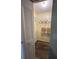 Walk-in closet with shelves and hanging rods, visible through an open louvered door at 7601 Como Dr, New Port Richey, FL 34655