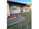 Charming single-story home with a welcoming front entrance and well-maintained landscaping at 7601 Como Dr, New Port Richey, FL 34655