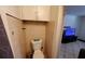 Half bath with a toilet, cabinet and tiled walls at 769 53Rd N Ter, St Petersburg, FL 33703