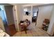 View of kitchen table with tile floor in a home needing some TLC at 769 53Rd N Ter, St Petersburg, FL 33703