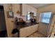 Compact kitchen with white cabinetry, appliances, and efficient layout for cooking at 769 53Rd N Ter, St Petersburg, FL 33703