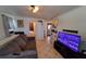 Cozy living room featuring tile floors, a comfortable sofa, and a television at 769 53Rd N Ter, St Petersburg, FL 33703