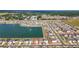 A beautiful aerial view of the home and neighborhood situated on a pond at 7782 Sail Clover Ln, Zephyrhills, FL 33540