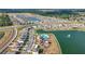 Stunning aerial view of a Primary-planned community with water features and resort-style amenities at 7782 Sail Clover Ln, Zephyrhills, FL 33540