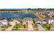 Beautiful two-story home with a well-manicured lawn and a serene water view in a Gathering-friendly community at 7782 Sail Clover Ln, Zephyrhills, FL 33540
